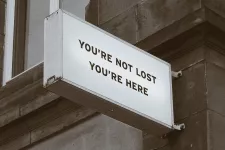 Picture of a sign that says you're not lost, you're here
